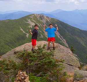 Stephen and Sam on the summit of Mt. Liberty.  That's Mt. Flume in the background.  Did you know that if you were to click your mouse at this very moment, you'd get a larger, stunning view of this picture?  Yes, grasshopper, it is true.  These and many more wonders await you with a mere click of your mouse.  Cleeck it, leetle girly-man.  Ya, cleeck it!